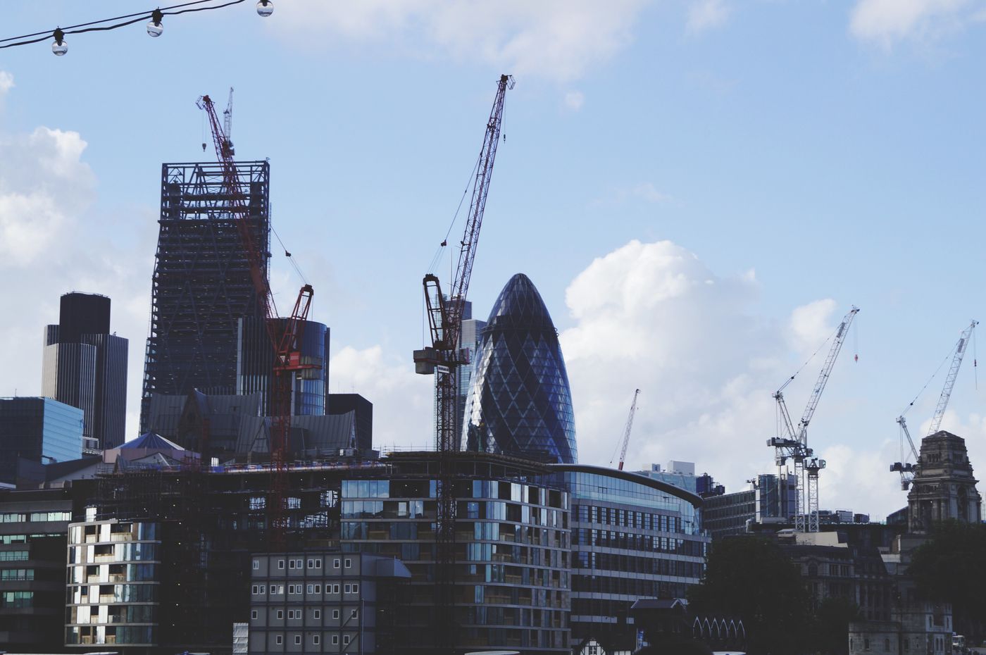 Commercial buildings under construction with tower cranes