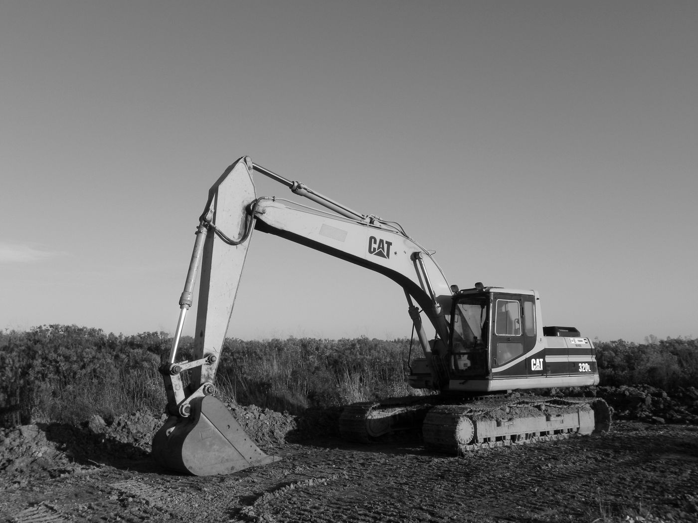 Excavator carrying out groundworks on a construction site
